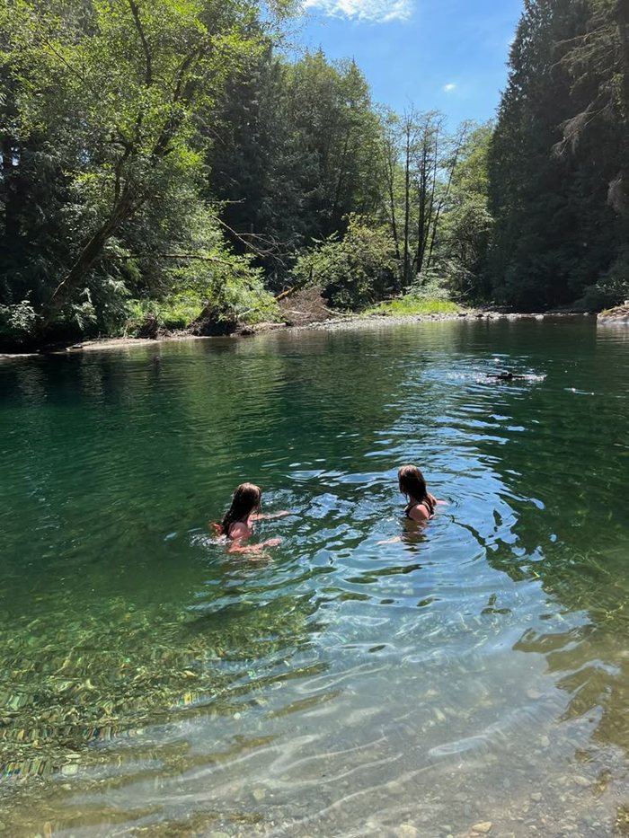 Students swimming in clear water